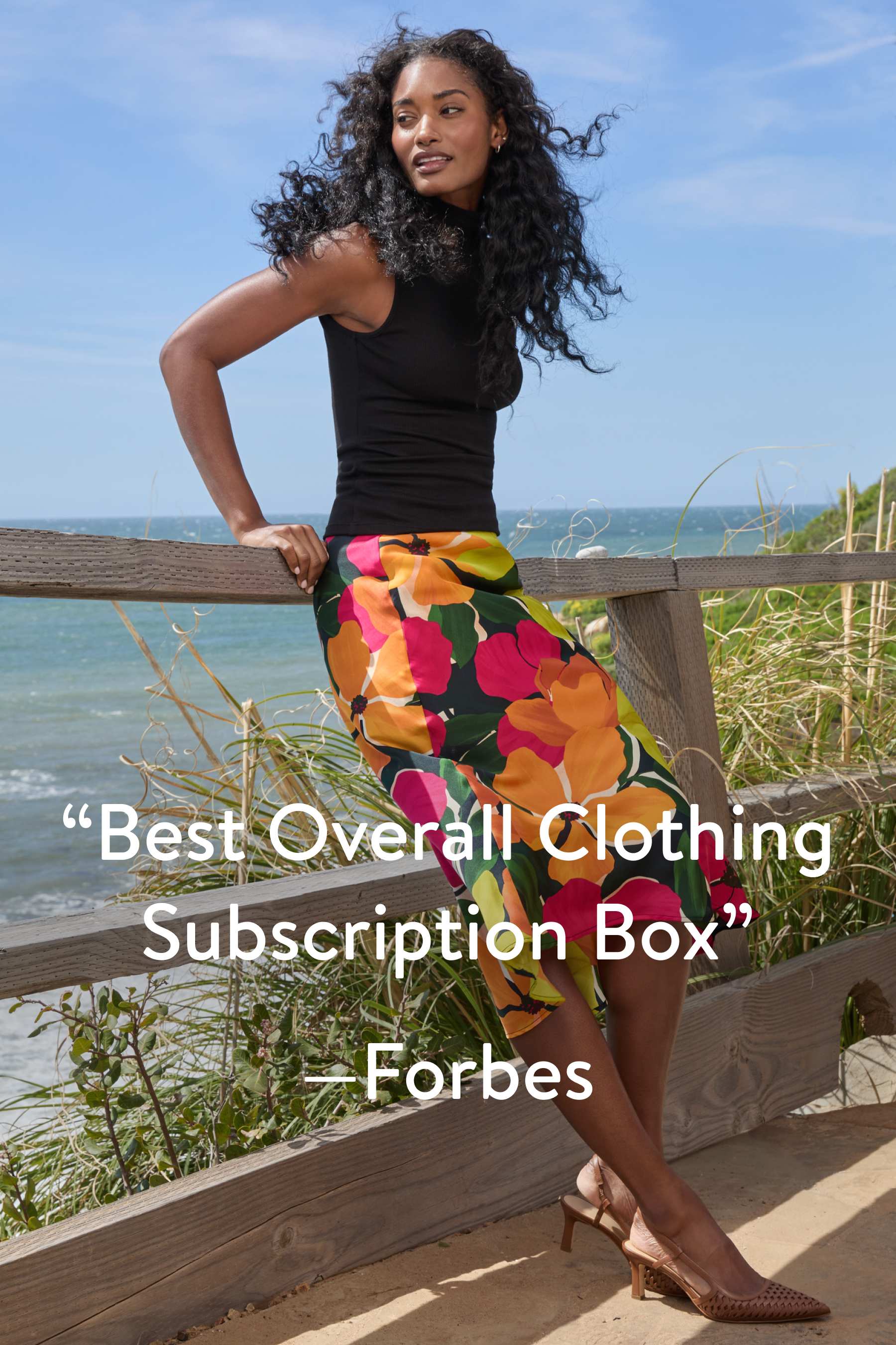 “Best Overall Clothing Subscription Box.” – Forbes. Model wearing Stitch Fix clothing including cream sweater and leopard print skirt, carrying a Stitch Fix box. 