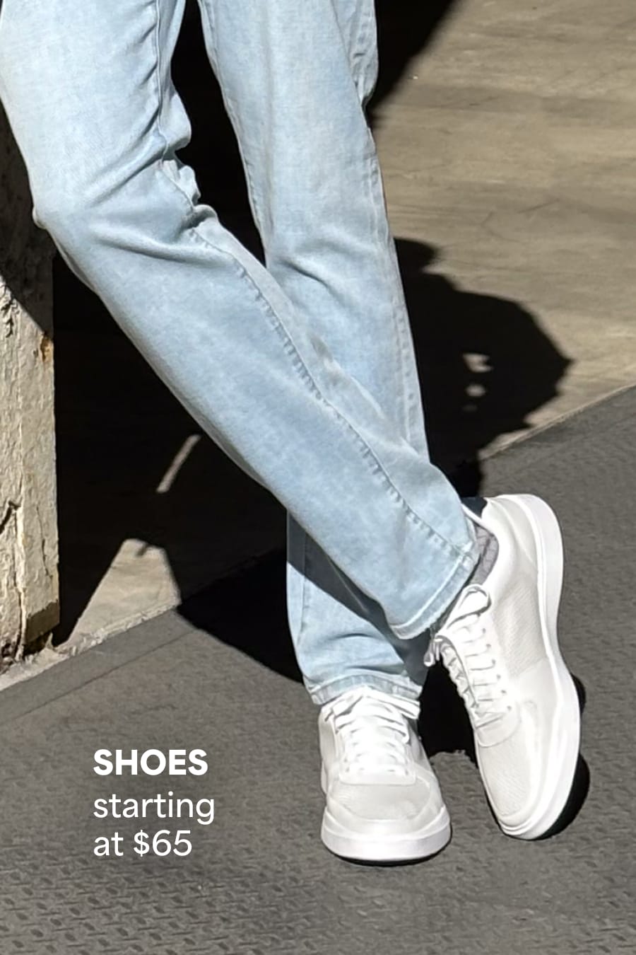 Model wearing Stitch Fix men’s clothes including light-wash jeans and white sneakers. Text reads: Shoes starting at $65