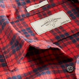 Close up image of a red and blue paid shirt label.