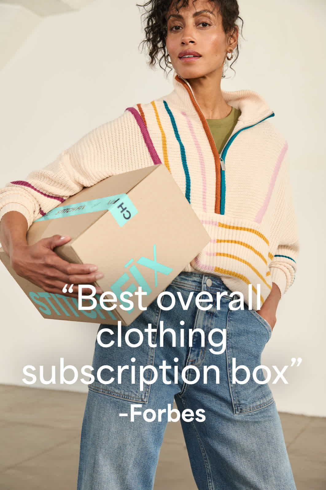 Model wearing Stitch Fix women’s clothes including half-zip sweater and wide-leg denim. Text reads: Best overall clothing subscription box - Forbes. 